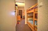 Cozy bunk beds in a charming hallway, perfect for a family getaway.