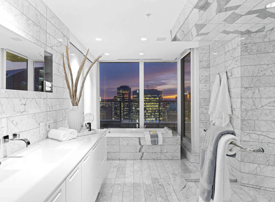 Luxury bathroom with stunning city views.