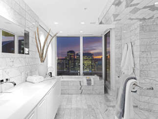 Luxury bathroom with stunning city views.