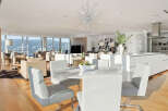 This luxurious condo boasts breathtaking panoramic views, an open-concept layout seamlessly blending the living, dining, and kitchen areas, and high-end finishes throughout.
