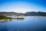 Stunning waterfront property with breathtaking views of the mountains and ocean.