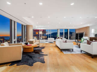 Experience luxury living in this stunning high-rise condo with breathtaking city and mountain views.