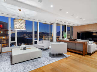 Experience luxury living with breathtaking city and mountain views from this stunning property.