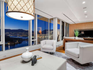 Experience luxury living with breathtaking city and water views from this stunning property.