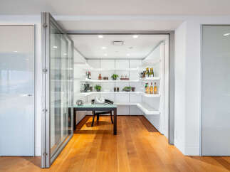 Step into luxury with this stunning property featuring a modern pantry and home office space.