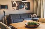 This inviting living space boasts a comfortable gray sectional sofa perfect for relaxation and entertaining.