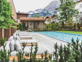 Discover a luxury real estate gem with a stunning outdoor pool and mountain views.