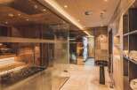 This luxurious spa area features a sauna, steam room, and infrared cabin, creating a relaxing retreat.