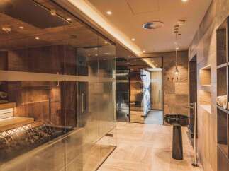 This luxurious spa area features a sauna, steam room, and infrared cabin, creating a relaxing retreat.