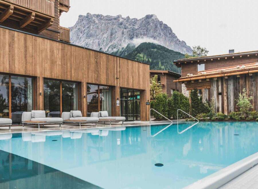 Experience luxury living with this stunning real estate featuring a pristine pool and breathtaking mountain views.