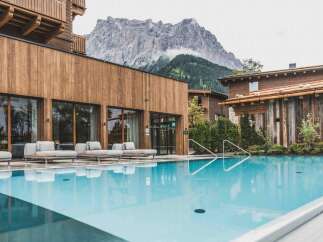 Experience luxury living with this stunning real estate featuring a pristine pool and breathtaking mountain views.