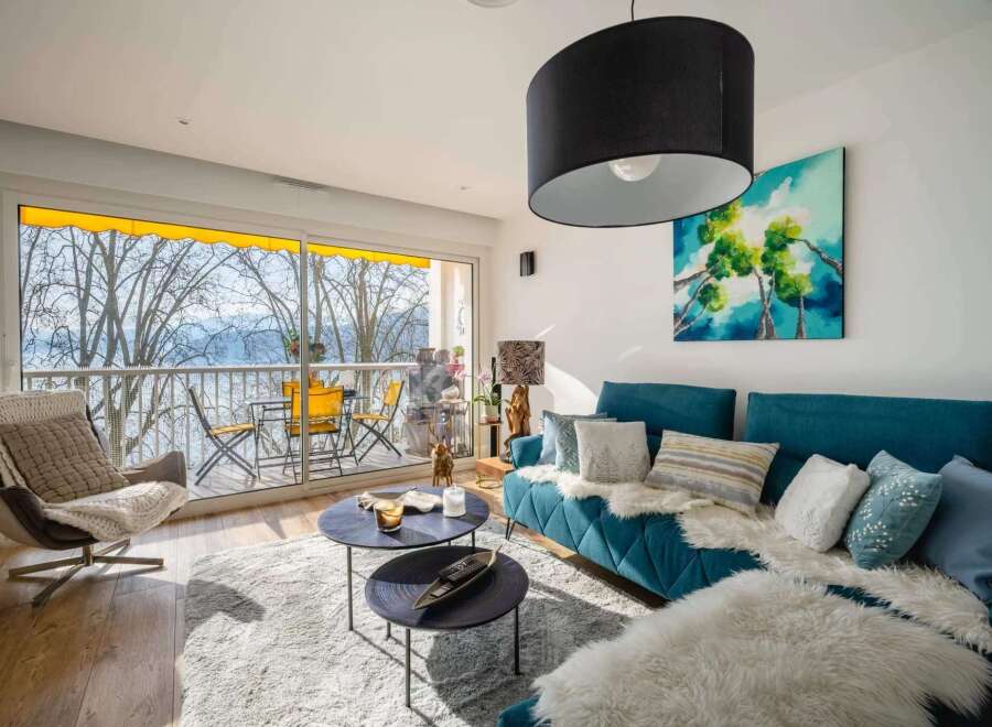 Stunning lake view apartment with modern furnishings and a spacious living area.