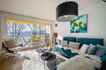 Stunning lake view apartment with modern furnishings and a spacious living area.