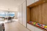 Stunning apartment boasting floor-to-ceiling windows offering breathtaking lake views.