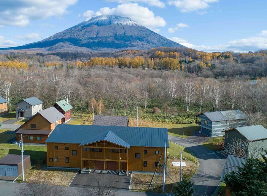 Nestled against a breathtaking mountain backdrop, this stunning property boasts a collection of charming, modern homes.