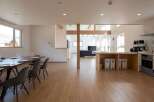 This stunning property boasts an open-plan living area with a spacious dining space and modern kitchen, perfect for entertaining.