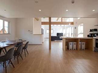 This stunning property boasts an open-plan living area with a spacious dining space and modern kitchen, perfect for entertaining.