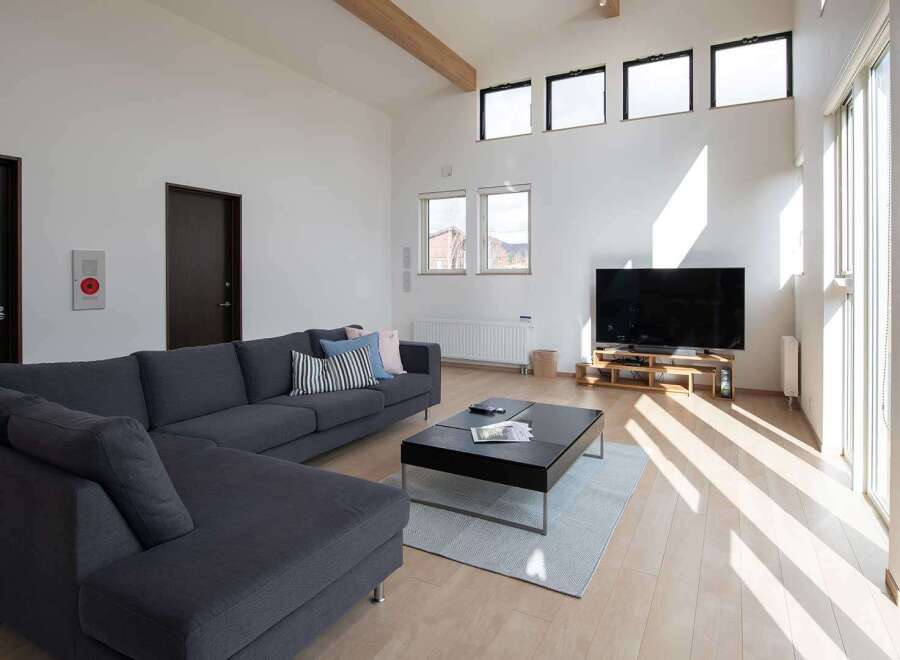 This stunning property boasts a spacious open-plan living area filled with natural light from large windows and skylights.