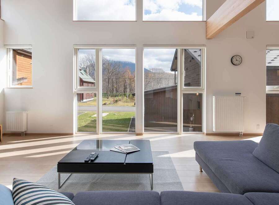 This stunning home boasts an open floor plan with floor-to-ceiling windows offering breathtaking views of the surrounding mountains and landscape.