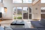 This stunning home boasts an open floor plan with floor-to-ceiling windows offering breathtaking views of the surrounding mountains and landscape.