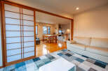 This stunning property boasts an open-plan living area with a modern kitchen and dining space, perfect for entertaining.