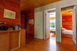 This stunning property boasts a spacious hallway with built-in wooden cabinets, offering ample storage.