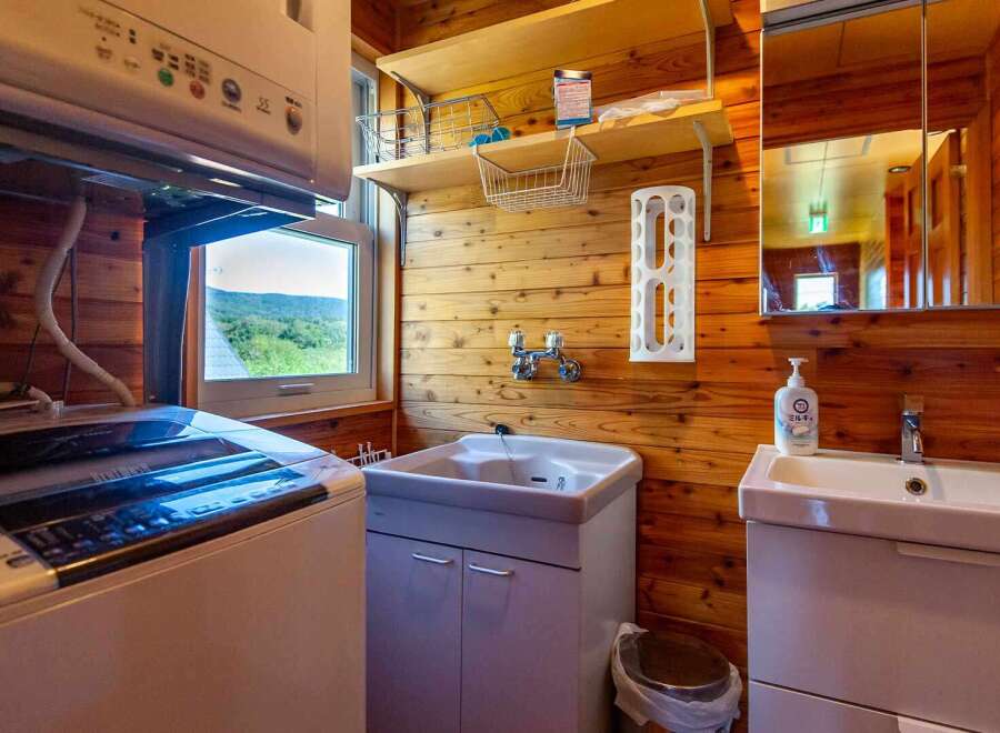 This cozy cabin boasts a convenient laundry area with a washer and dryer, perfect for longer stays.