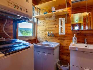 This cozy cabin boasts a convenient laundry area with a washer and dryer, perfect for longer stays.