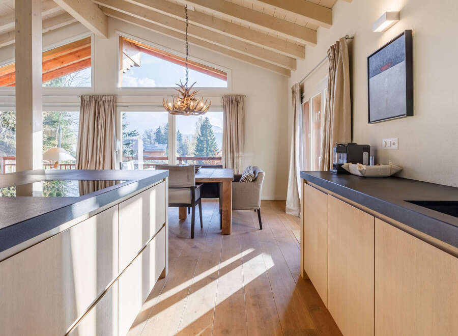 Experience the epitome of luxury in this stunning property, boasting a modern kitchen with sleek countertops and ample storage.