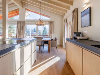 Experience the epitome of luxury in this stunning property, boasting a modern kitchen with sleek countertops and ample storage.