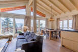 Experience luxury living in this stunning property, featuring expansive windows that frame breathtaking mountain views.