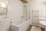 This bright and airy bathroom features a modern design with clean lines and a minimalist aesthetic.