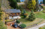 Discover a charming chalet nestled in a picturesque mountain setting.