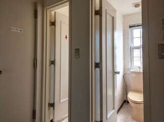 This property features a clean and well-maintained restroom with a toilet and sink.
