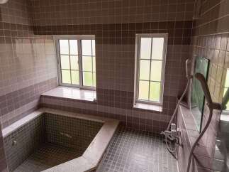 This charming bathroom boasts a unique built-in bathtub, perfect for relaxation.