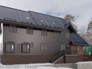 This stunning property boasts a modern exterior with dark metal siding and a striking dark brown stone base.