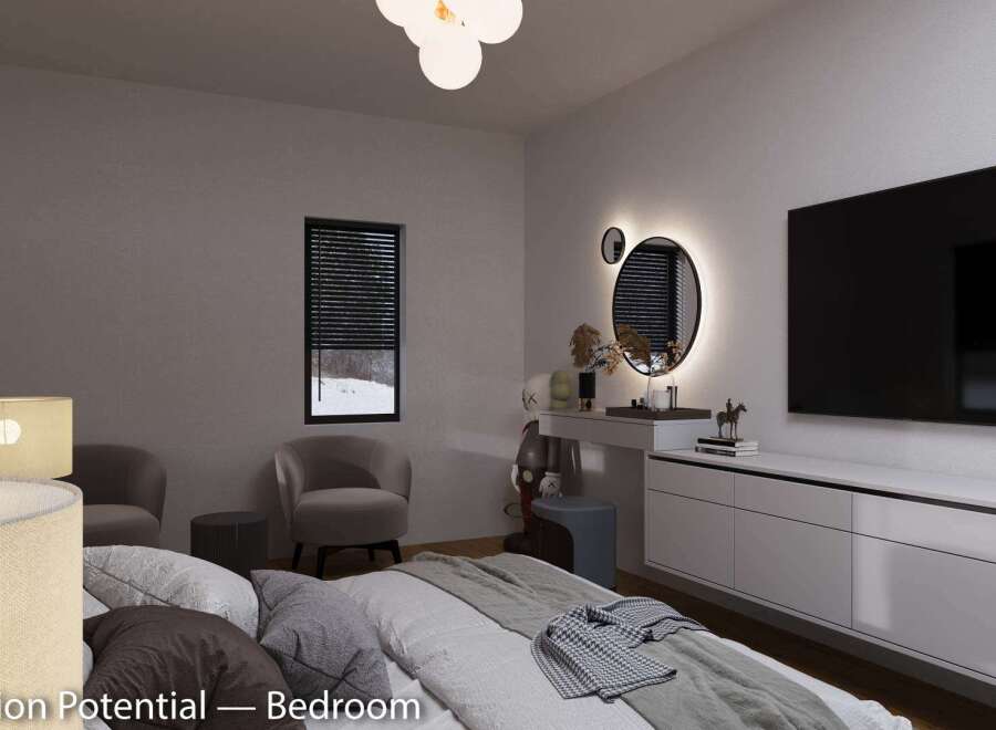 This bedroom boasts a stylish and modern design, featuring a large TV, comfortable seating, and a sleek vanity area with illuminated mirrors.