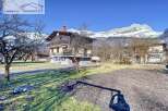 Discover a charming property nestled in a picturesque mountain setting.