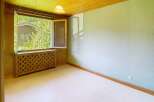 Discover the charm of this inviting room, featuring a bright, open window that frames a picturesque view.