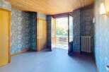 Discover the charm of this inviting property, featuring a bright and airy interior with a beautiful wooden ceiling.