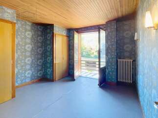 Discover the charm of this inviting property, featuring a bright and airy interior with a beautiful wooden ceiling.