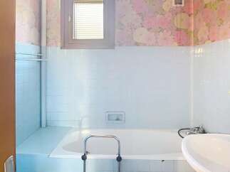 Step into this charming bathroom, featuring a classic design with a touch of vintage flair.