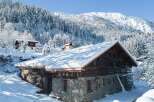 Nestled in a snowy mountainside, this charming chalet offers breathtaking views and serene winter landscapes.