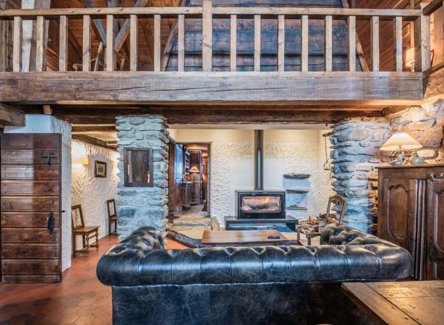 This stunning chalet boasts a beautiful stone fireplace, perfect for cozy nights in.