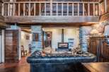 This stunning chalet boasts a beautiful stone fireplace, perfect for cozy nights in.