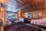 Rustic charm meets modern comfort in this unique wooden-paneled room.