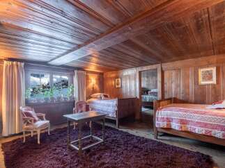 Rustic charm meets modern comfort in this unique wooden-paneled room.