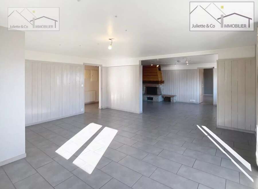 Discover this charming property featuring a spacious living area with a cozy fireplace, perfect for relaxing evenings.