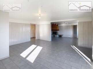 Discover this charming property featuring a spacious living area with a cozy fireplace, perfect for relaxing evenings.