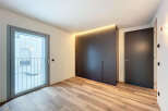 Modern apartment boasting sleek built-in wardrobes and stylish flooring.